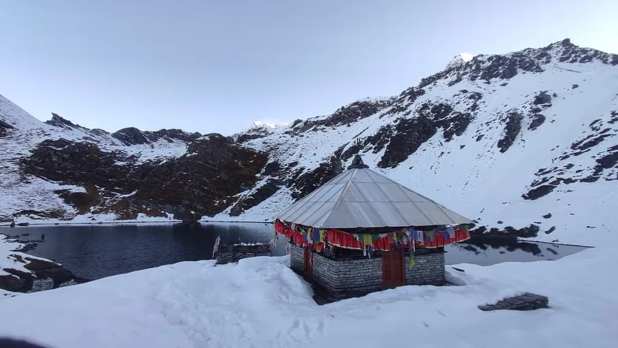 The shrine at Khayer Lake wrapped in prayer flags after fresh snowfall